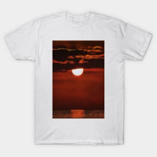 quickly setting sun off the coast of Bali Indonesia T-Shirt